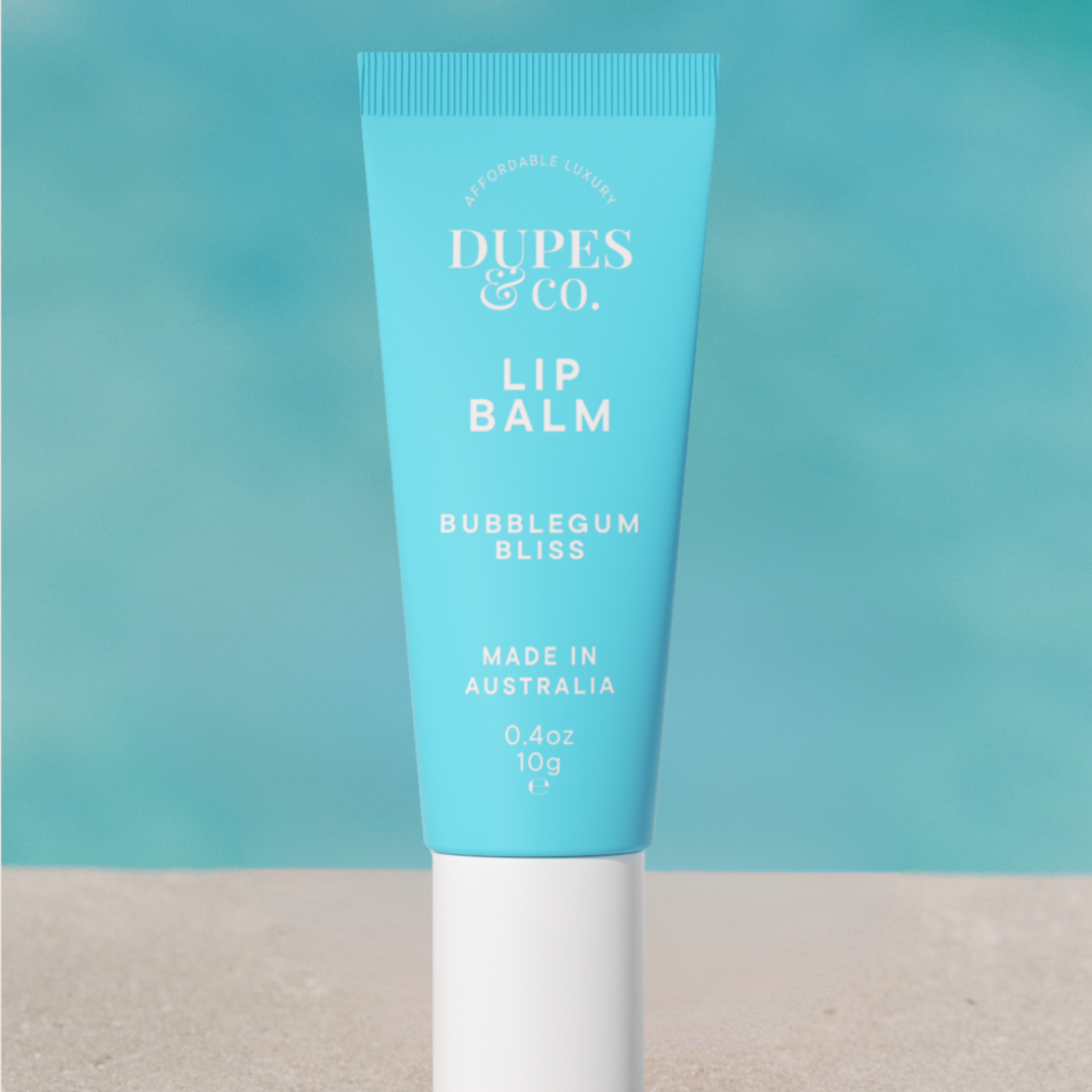 Dupes & Co Bubblegum Bliss Lip Balm tube front view