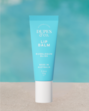 Dupes & Co Bubblegum Bliss Lip Balm tube front view