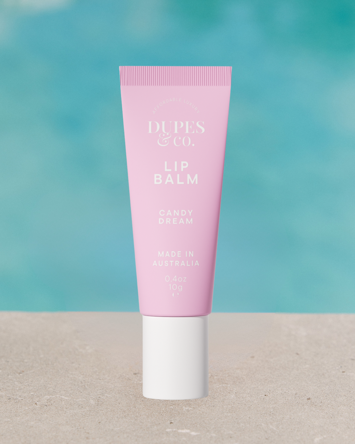 Dupes & Co Candy Dream Lip Balm tube front view